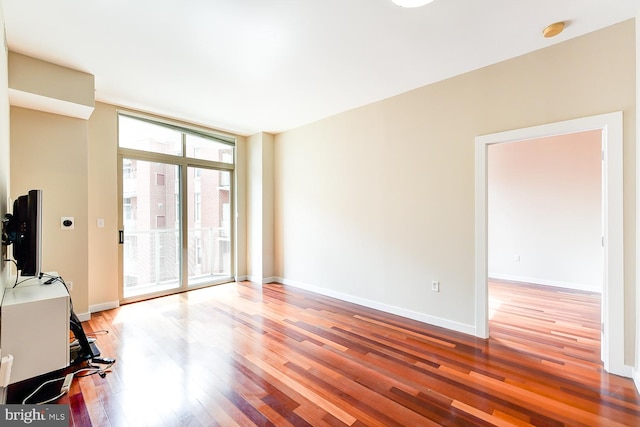 interior space with hardwood / wood-style flooring and expansive windows