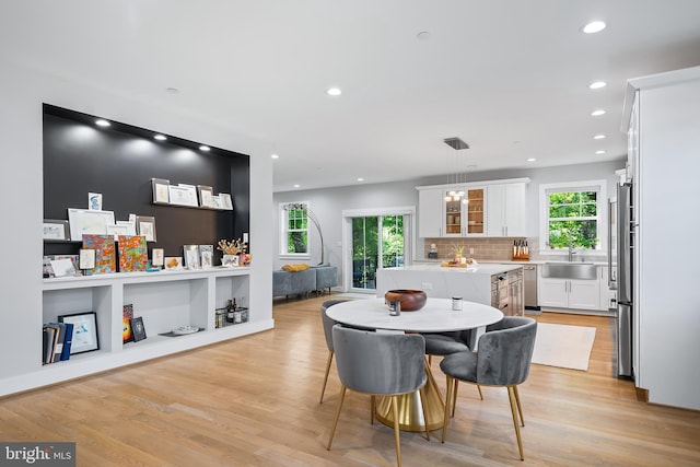 dining room featuring light wood-style floors and recessed lighting