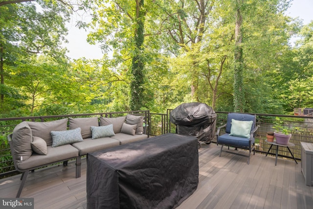 deck featuring a grill and outdoor lounge area