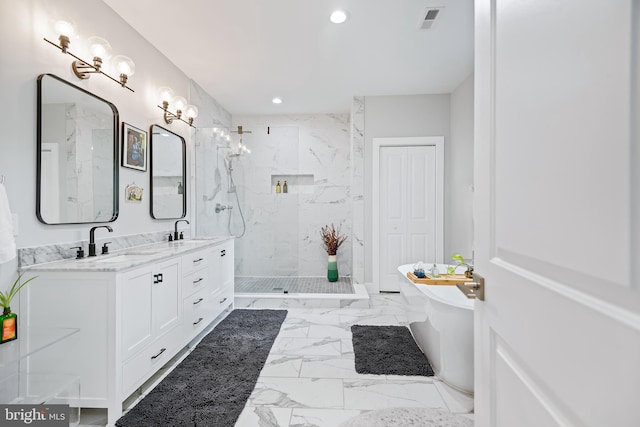 full bathroom with marble finish floor, a closet, a sink, and visible vents