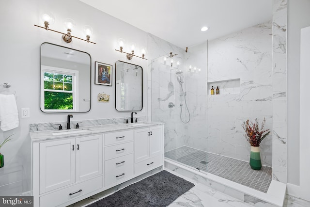 full bathroom featuring marble finish floor, double vanity, a sink, and a marble finish shower