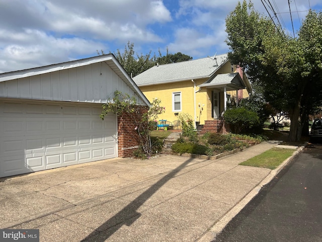 view of side of property with a garage