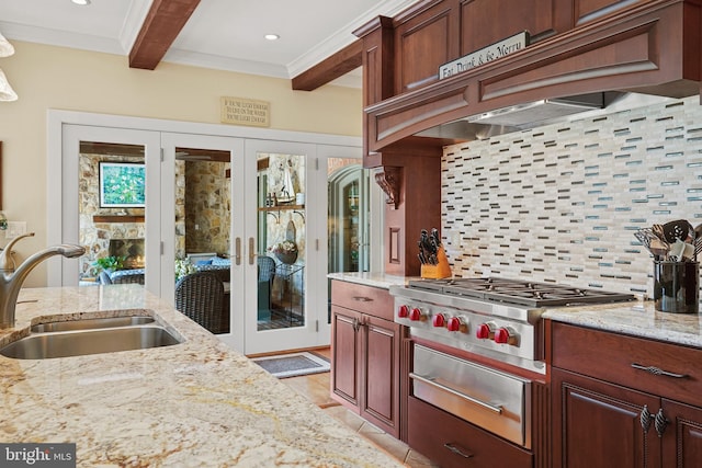 kitchen featuring crown molding, sink, premium range hood, stainless steel gas cooktop, and beam ceiling