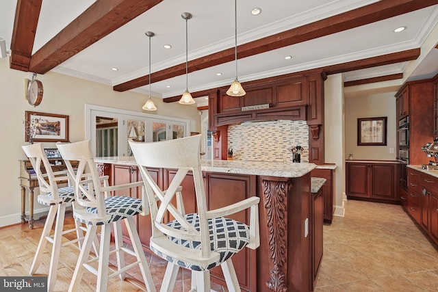 kitchen featuring backsplash, decorative light fixtures, light stone counters, a kitchen island, and beam ceiling