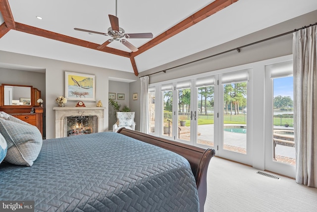 carpeted bedroom featuring ceiling fan, lofted ceiling with beams, and access to outside