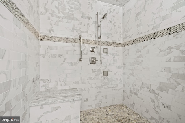 bathroom featuring tiled shower