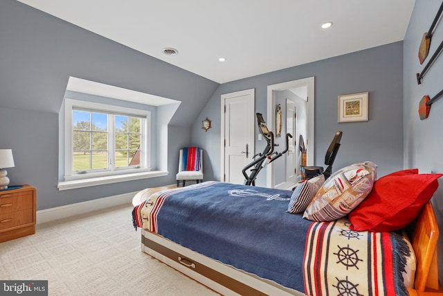 carpeted bedroom featuring lofted ceiling