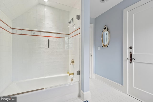 bathroom featuring shower / bath combination with glass door and tile patterned floors