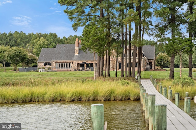 dock area with a water view