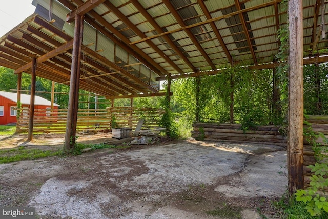 view of patio with an outbuilding