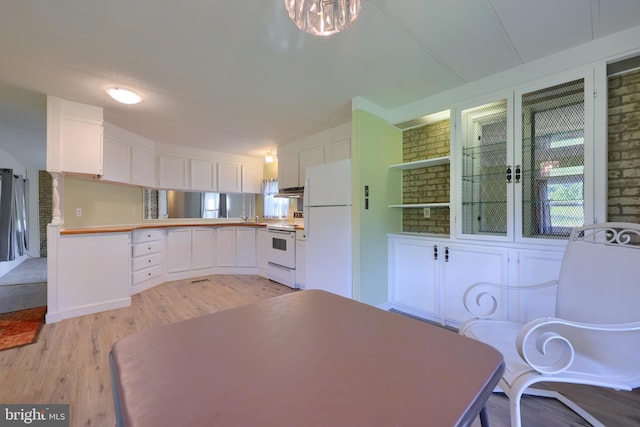 unfurnished dining area featuring light hardwood / wood-style floors