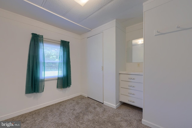 unfurnished bedroom with light colored carpet