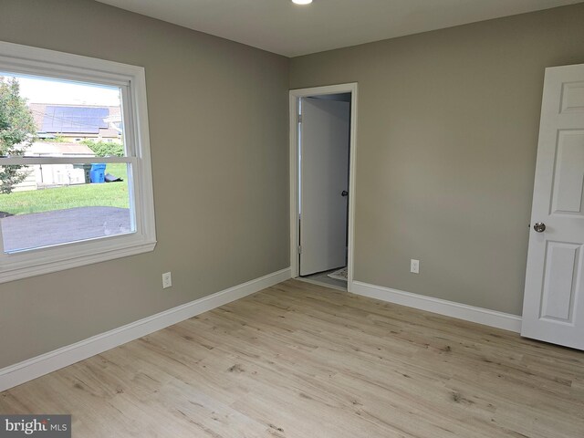 empty room with light hardwood / wood-style floors