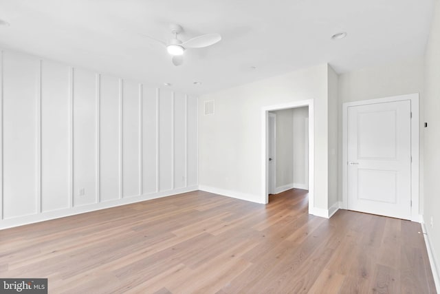 spare room with ceiling fan and light hardwood / wood-style flooring