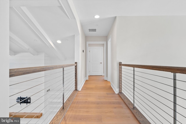 hall featuring light wood finished floors, recessed lighting, visible vents, an upstairs landing, and baseboards