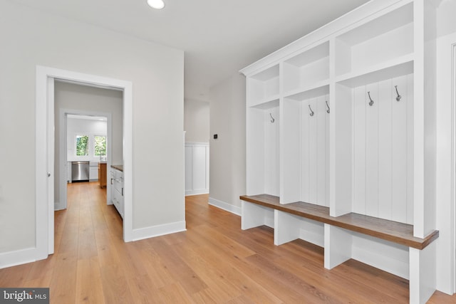 mudroom with light hardwood / wood-style flooring