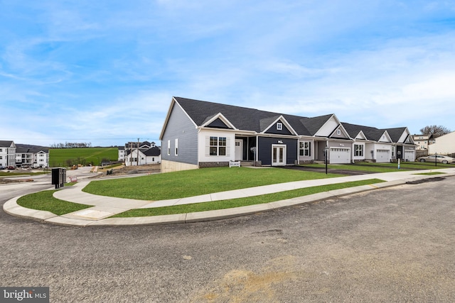 view of front of house with a residential view and a front lawn