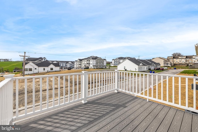 wooden deck with a residential view