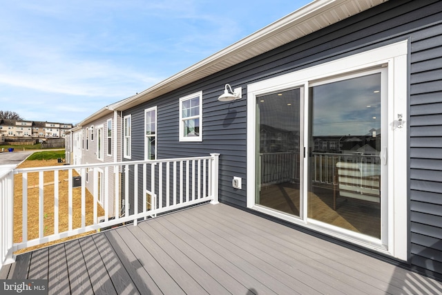 wooden deck with a residential view