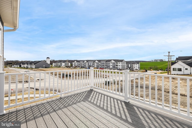 wooden terrace with a residential view