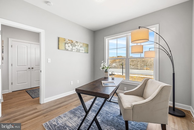 office space with light hardwood / wood-style floors