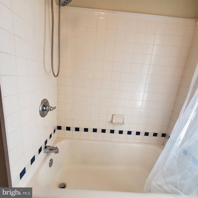 bathroom featuring shower / bath combination with curtain