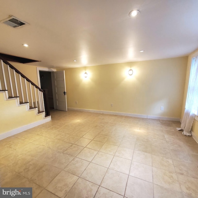 basement with stairs, recessed lighting, visible vents, and baseboards