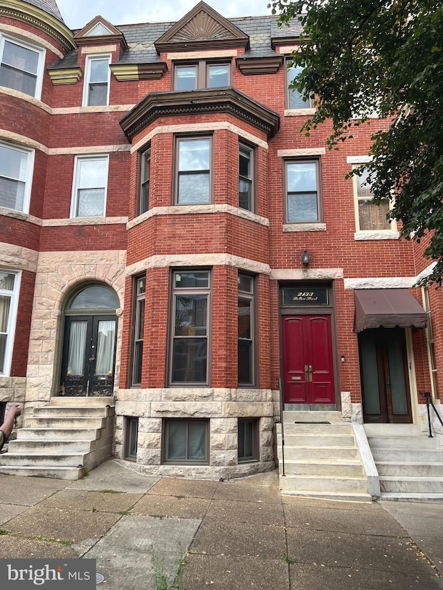 view of front of home featuring brick siding