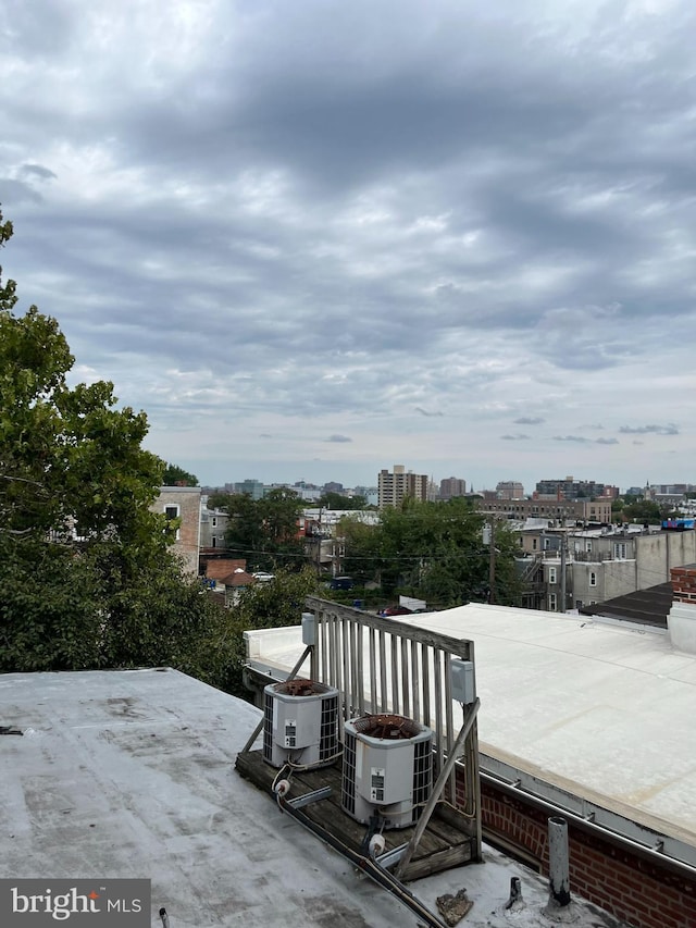 exterior space featuring a view of city and cooling unit