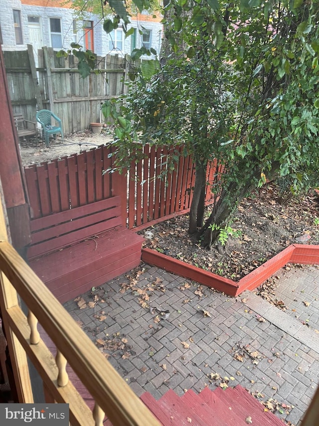 deck with a patio area and fence