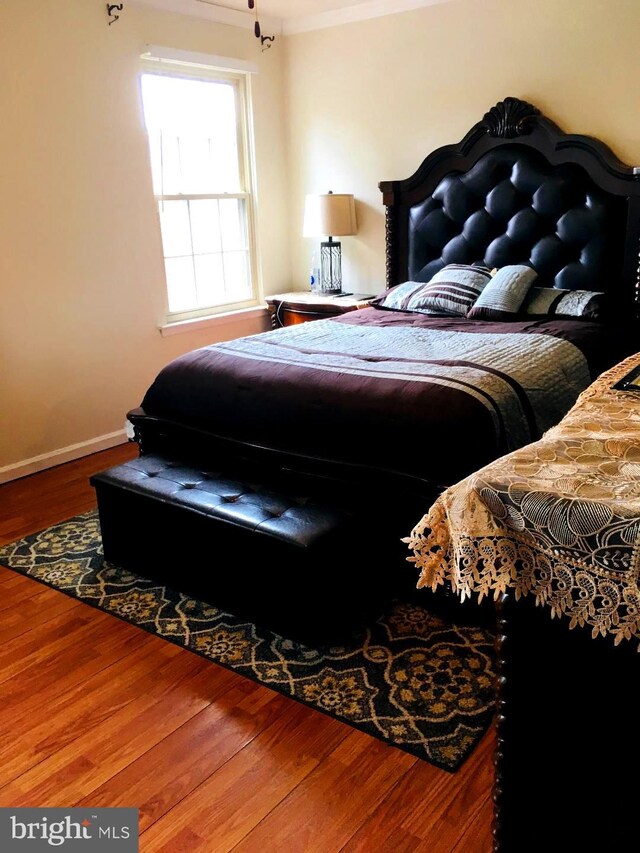 bedroom with wood-type flooring