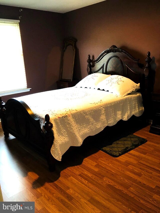 bedroom featuring wood-type flooring