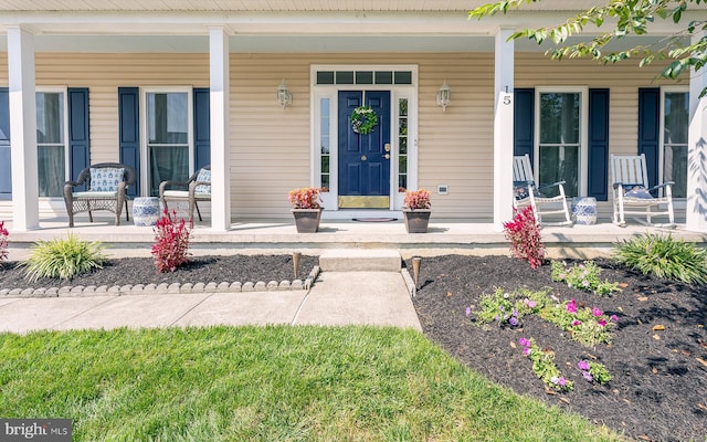 doorway to property featuring a porch