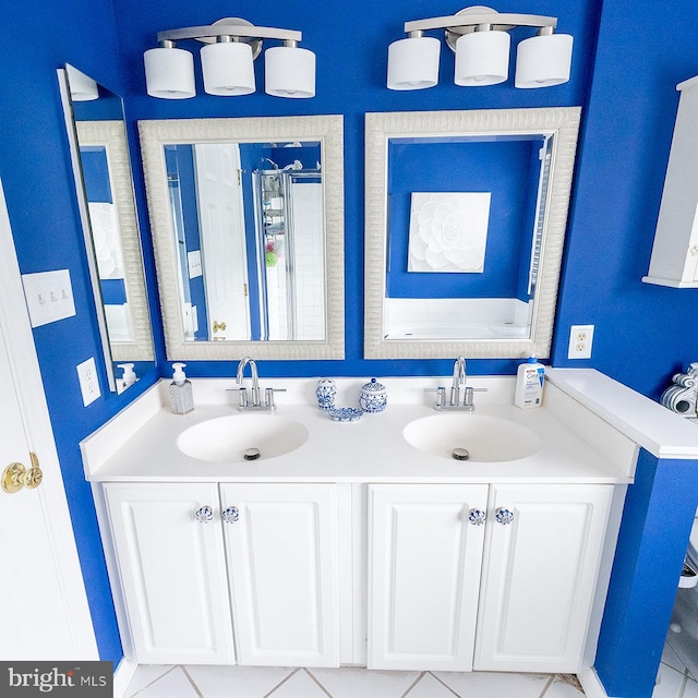 bathroom featuring vanity, separate shower and tub, and tile patterned floors