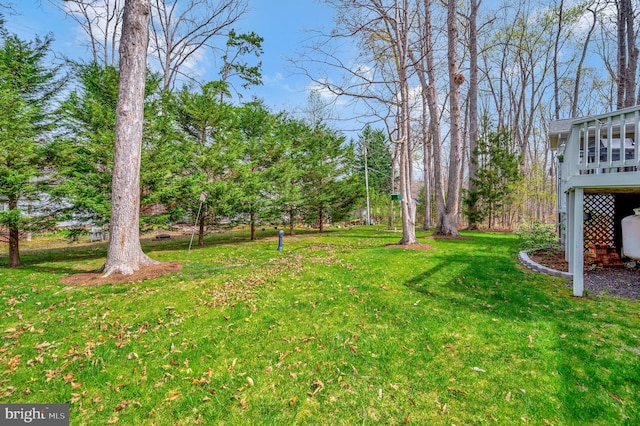 view of yard with a deck