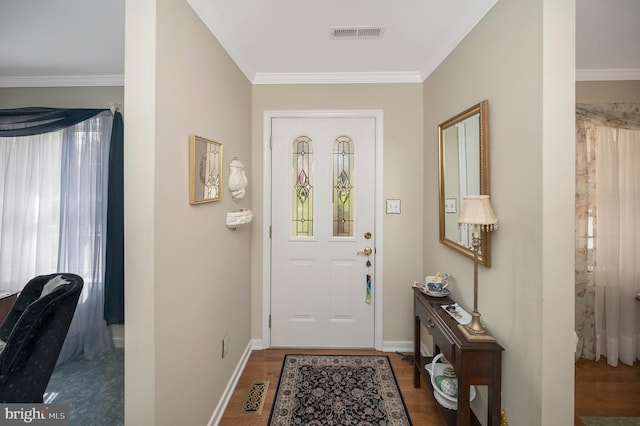 doorway to outside with crown molding and dark wood-type flooring