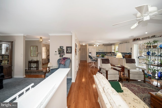 living room with hardwood / wood-style flooring and ornamental molding