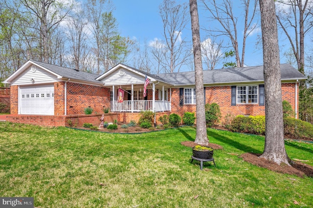 ranch-style home with a garage, a front yard, and covered porch