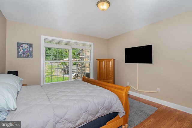 bedroom featuring hardwood / wood-style flooring