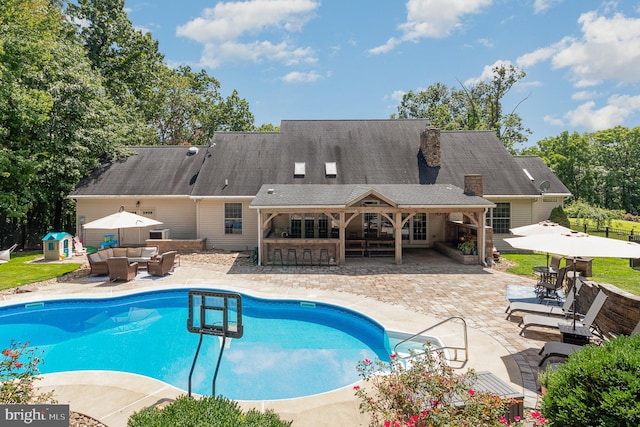 view of pool featuring a patio and an outdoor hangout area