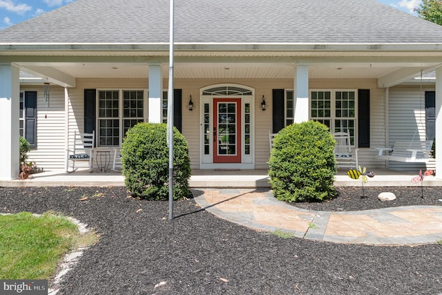 entrance to property with a porch