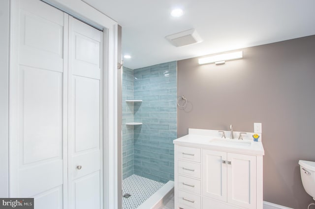 full bathroom with recessed lighting, a closet, toilet, a shower stall, and vanity