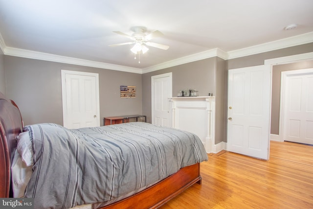 bedroom with baseboards, ceiling fan, ornamental molding, and light wood-style floors