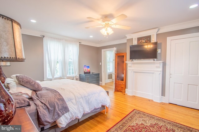 bedroom with light wood-style floors, recessed lighting, ornamental molding, and baseboards