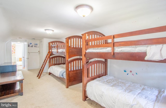 bedroom with light colored carpet