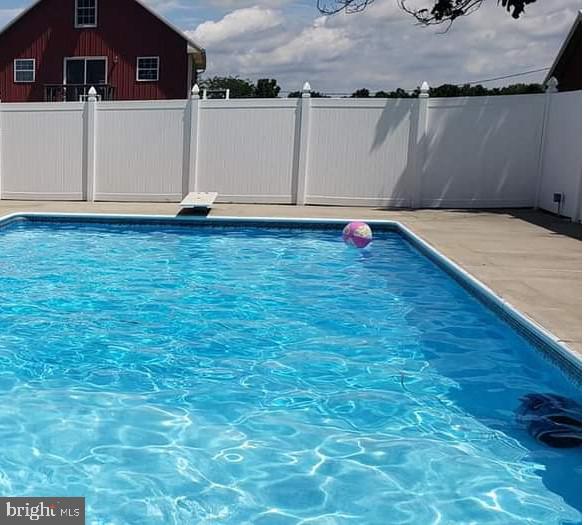 view of pool with fence and a fenced in pool