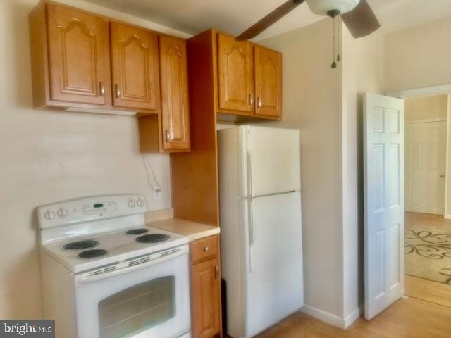 kitchen with ceiling fan, light hardwood / wood-style flooring, and white appliances