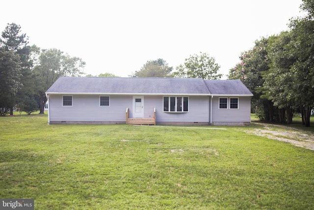 ranch-style home featuring a front yard