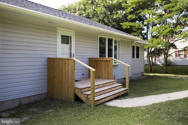 wooden terrace with a yard