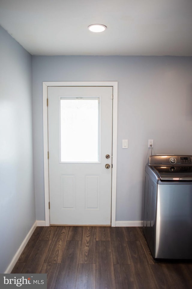 interior space with washer / dryer and dark hardwood / wood-style floors